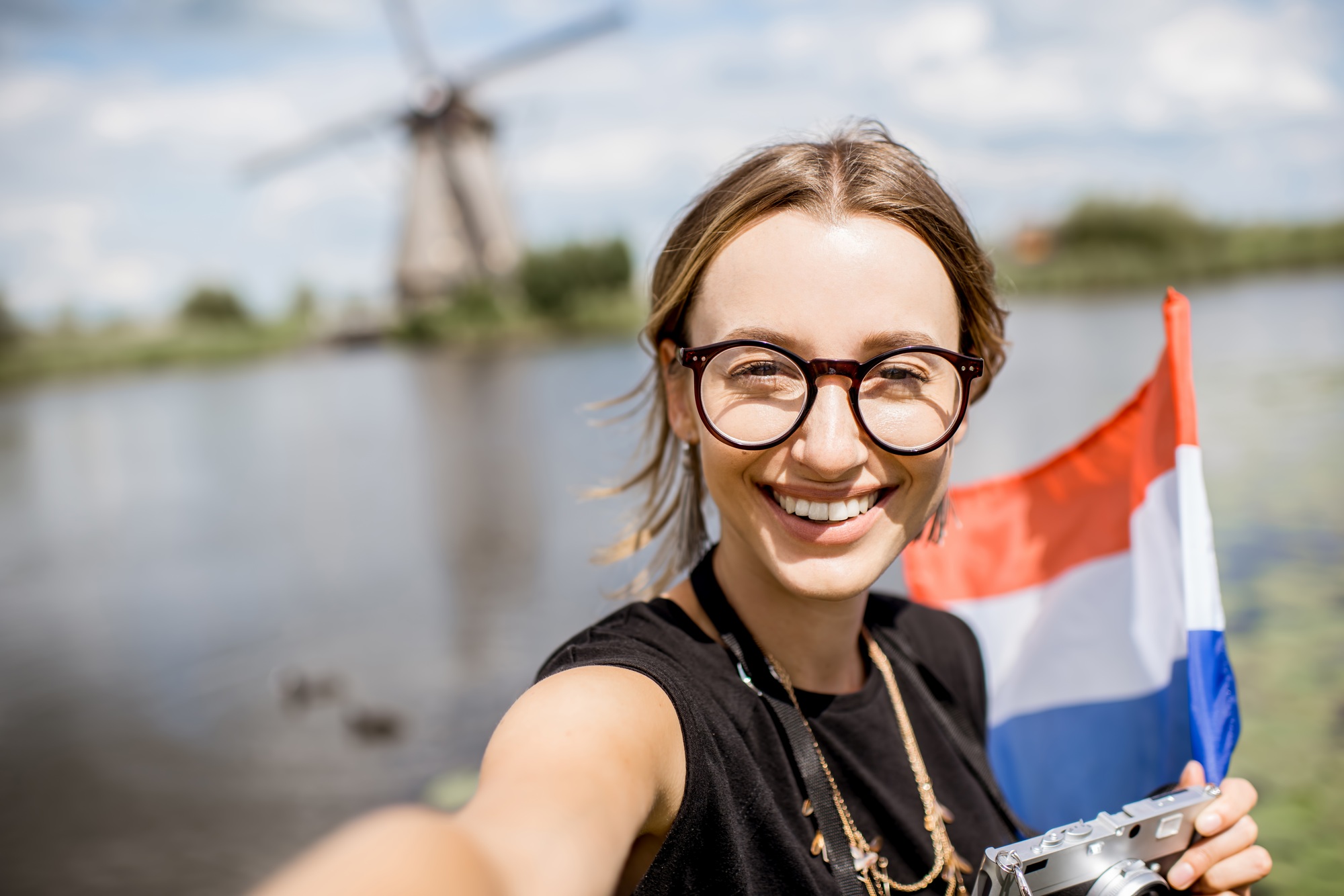 Woman near the old windmills in Netherlands
